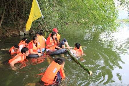 Team Five is getting across the river on the bamboo raft they made.
