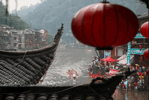 Dragon boat racing in fenghuang ancient town