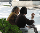 Old ladies have a idle take beside a lake in Guilin