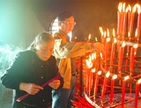 Chinese burning joke sticks for good luck and happiness inside a temple