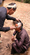 Head shaving in Basha