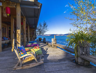 chairs on the bank of the lake